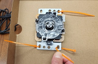 Zip ties securing the joystick